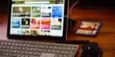 a laptop computer and mouse on a desk